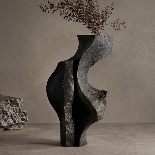 PULMORY black wave-cut stone vase with dried wildflower branches, raw cracked texture, clean product shot